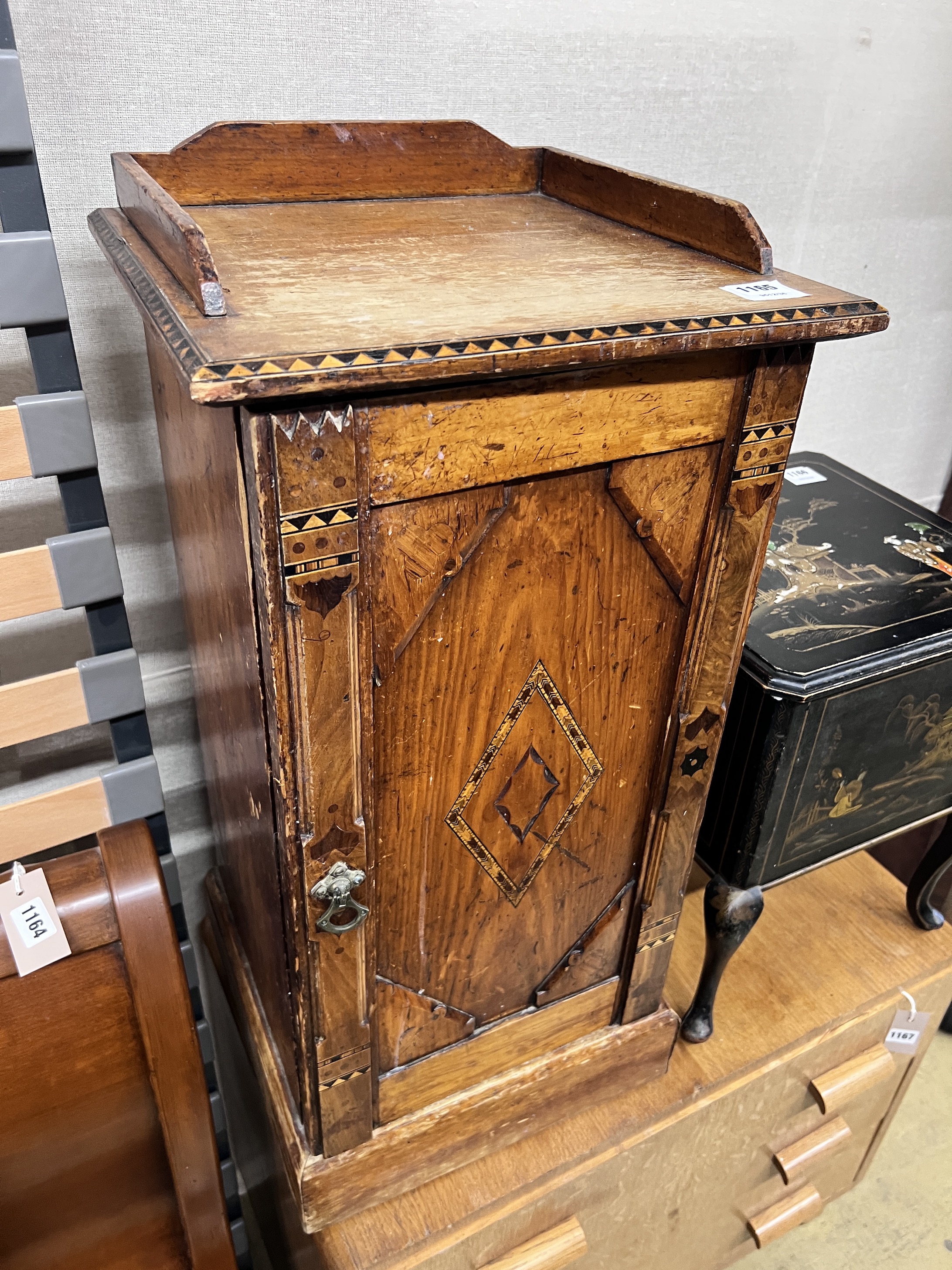 A late Victorian inlaid pine bedside cabinet, width 38cm